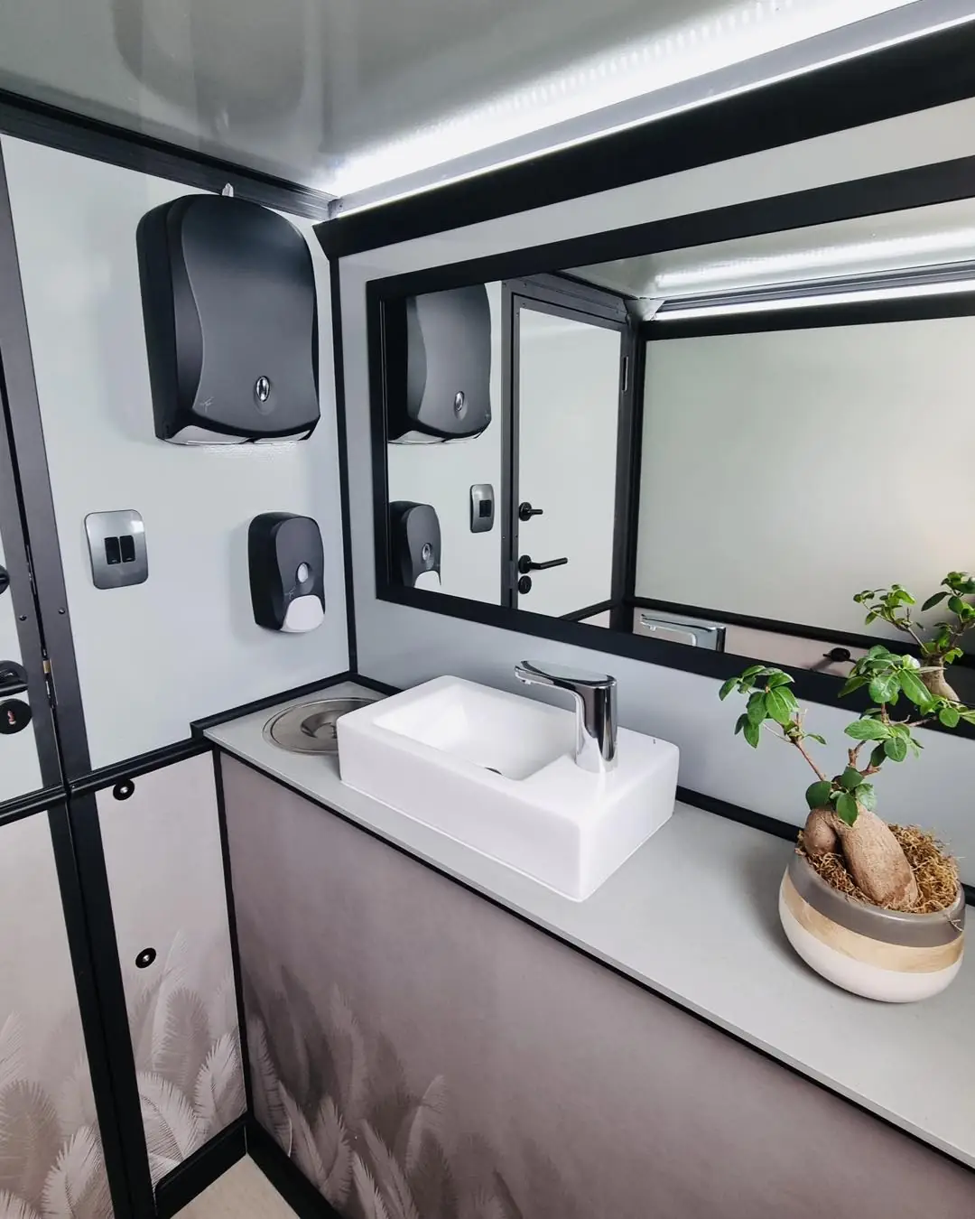 Restroom trailer vanity and mirror