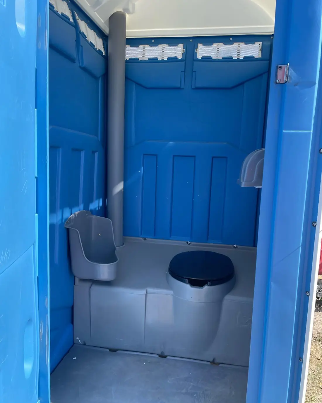 standard porta potty interior blue