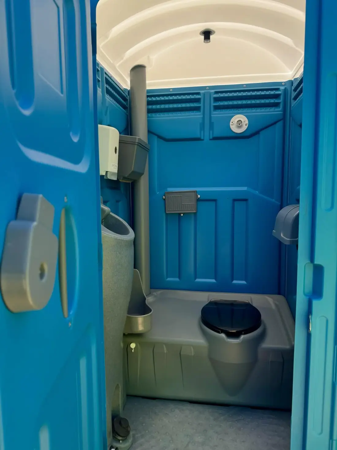 Inside a standard porta potty