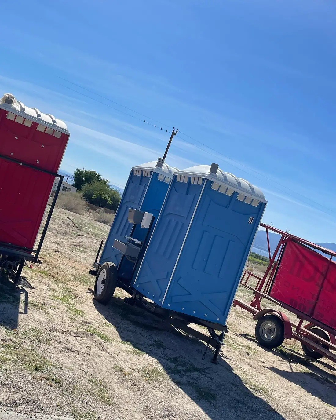Towable porta potty trailers on a jobsite